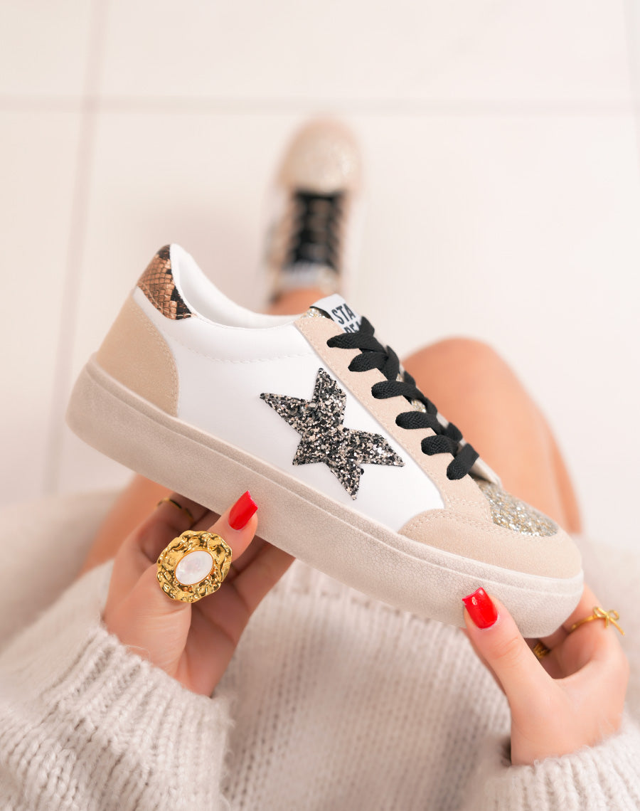 Trendy white women's sneakers with glitter stars and golden details