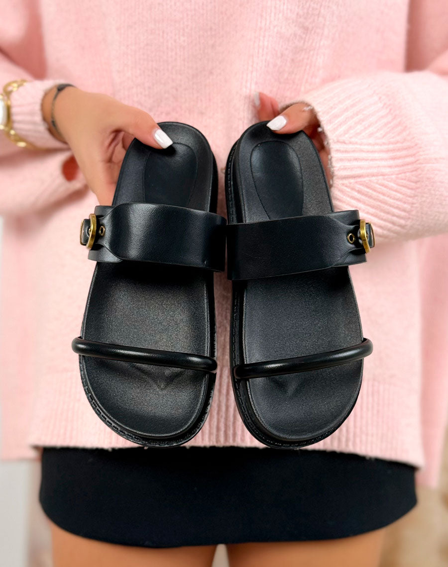 Mules noires à bride avec boucle dorée
