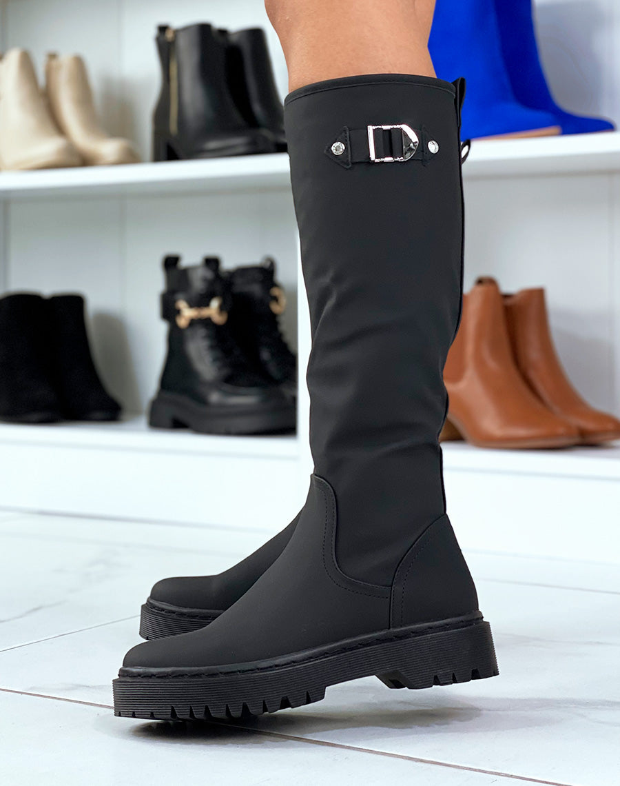 Bottes montantes noirs à semelles plates à détails dorées