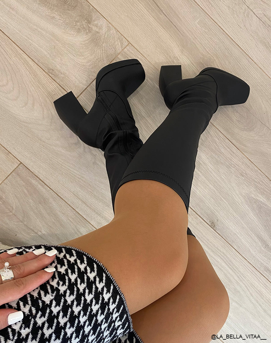 Bottes noires effet chaussettes à talon haut