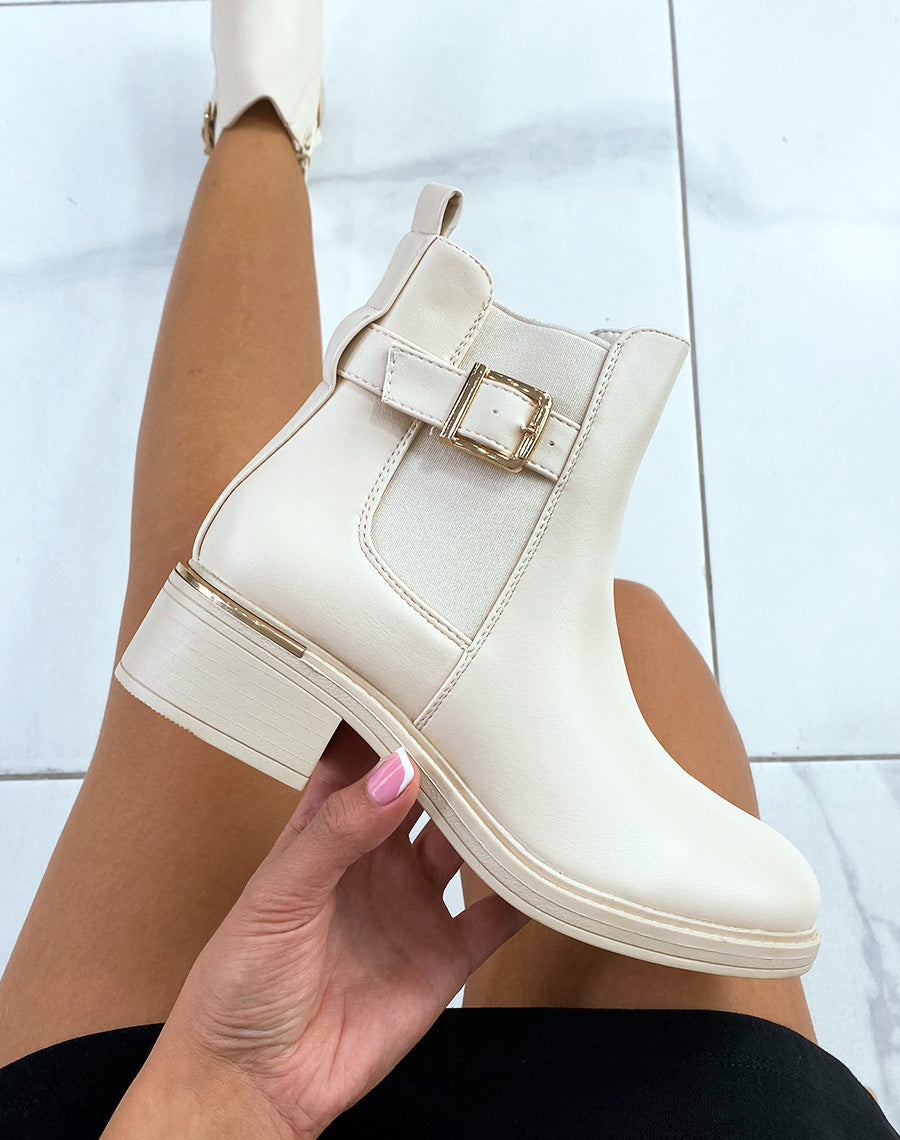 Bottines beiges à lanière ajustable et talon à détail doré