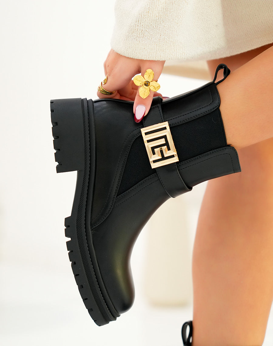 Bottines femme noires avec boucle dorée géométrique et semelle crantée