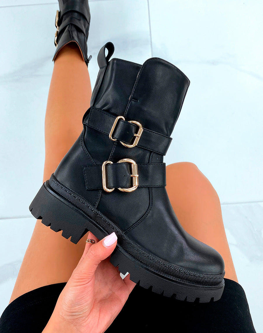 Bottines hautes noires à boucles dorées
