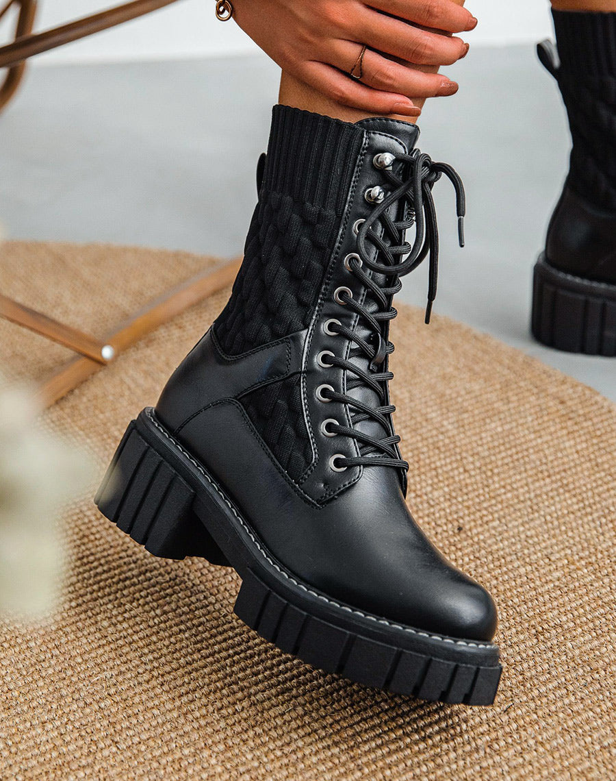 Bottines montantes noires bi-matière à semelle talonnée et crantée