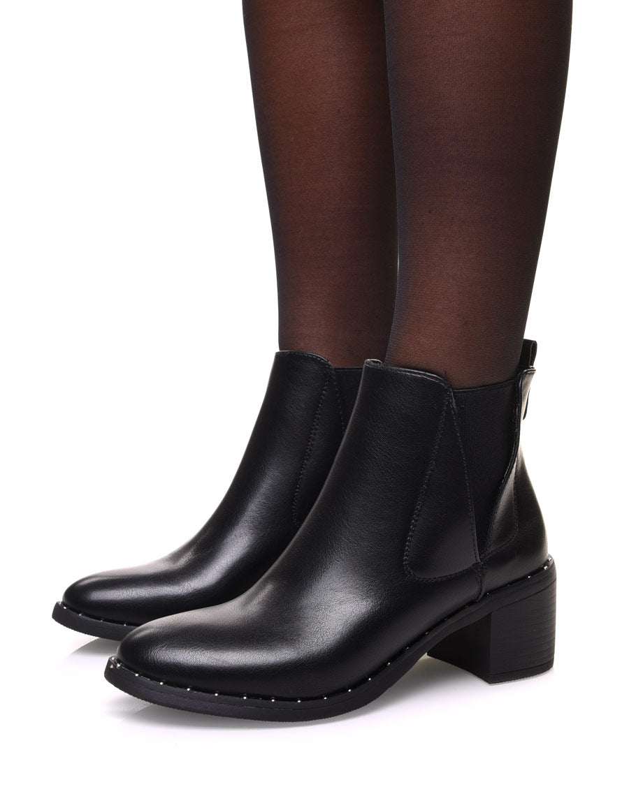 Bottines noires à élastiques échancrés et talon mi haut