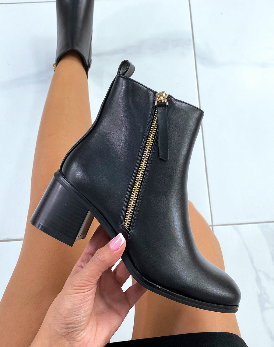 Bottines noires à zip doré et petit talon