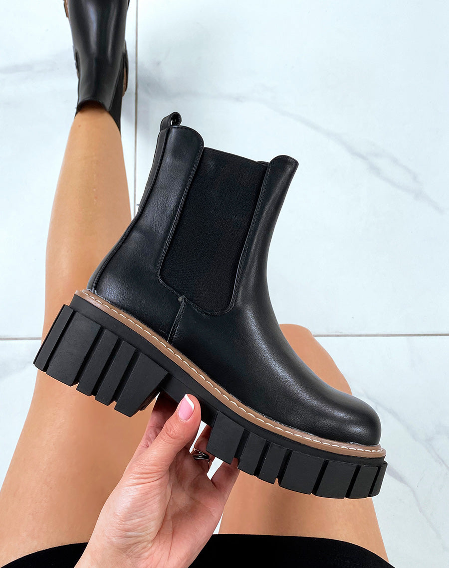Chelsea boots noires à semelle décorée d’un liseré marron