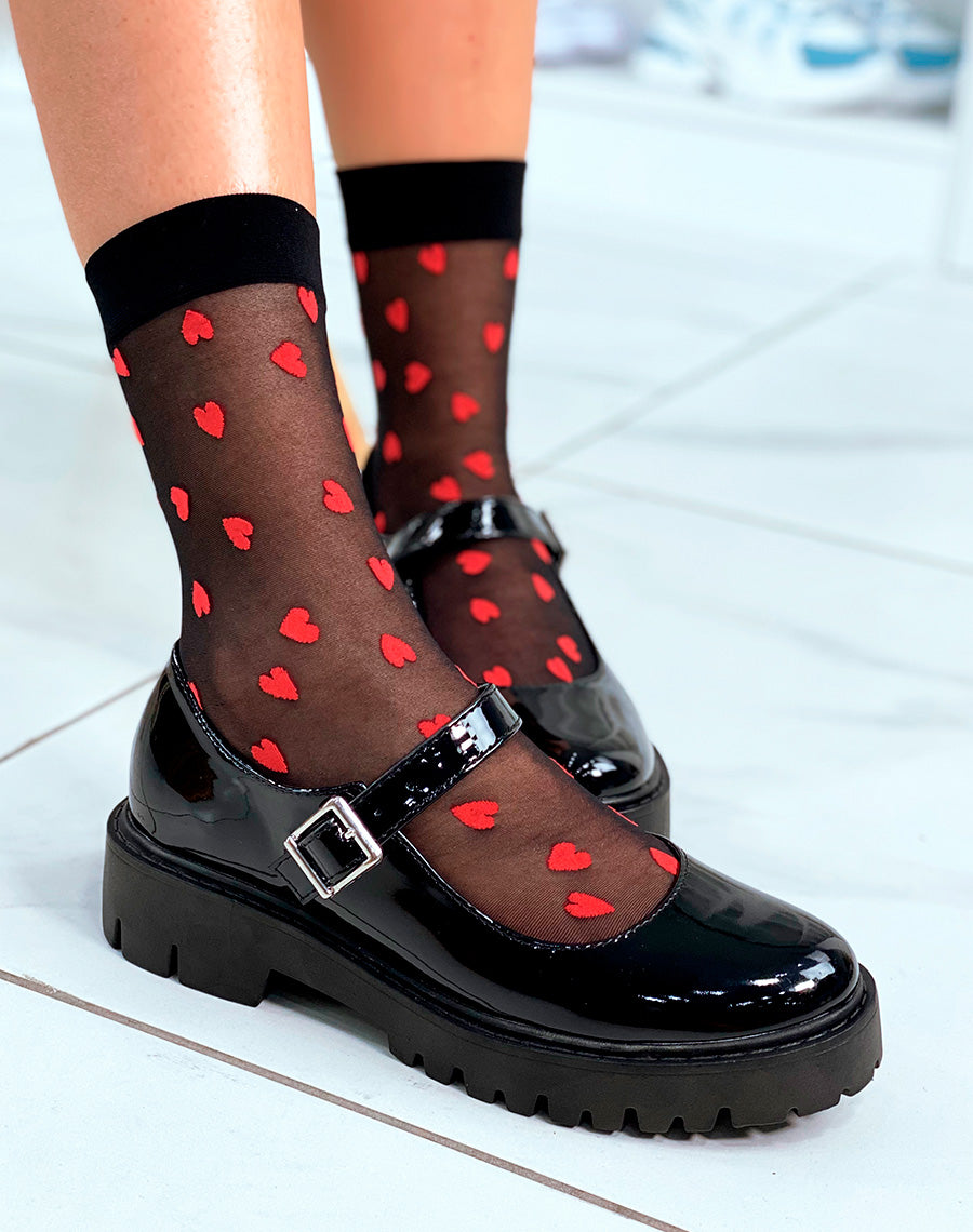 Mocassins noires vernis ouverts tendance avec lanière argentée 