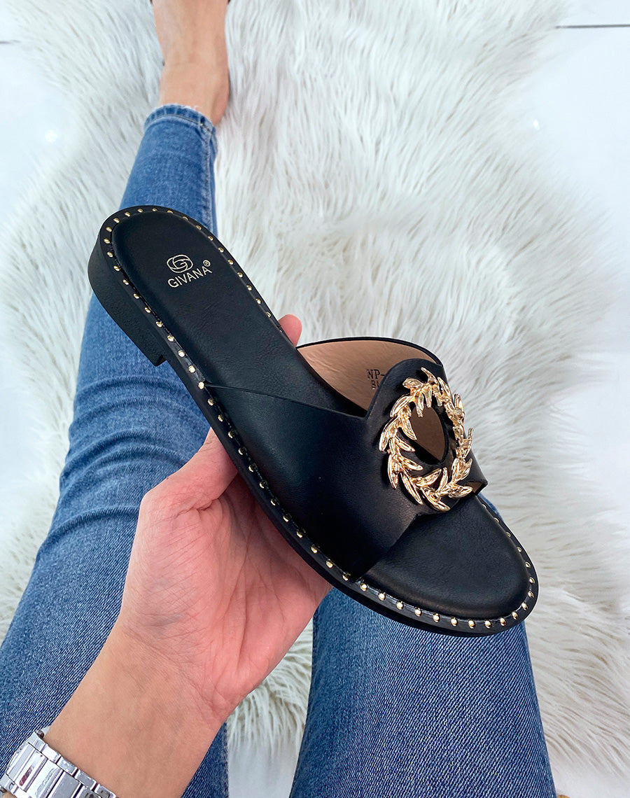 Mules noires à bijou rond et doré