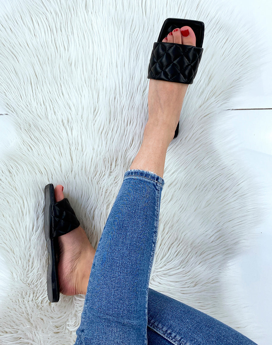 Mules plates noires matelassées