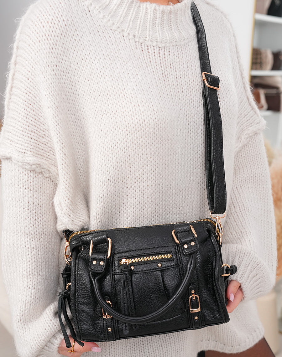 Sac à main noir à détails dorés
