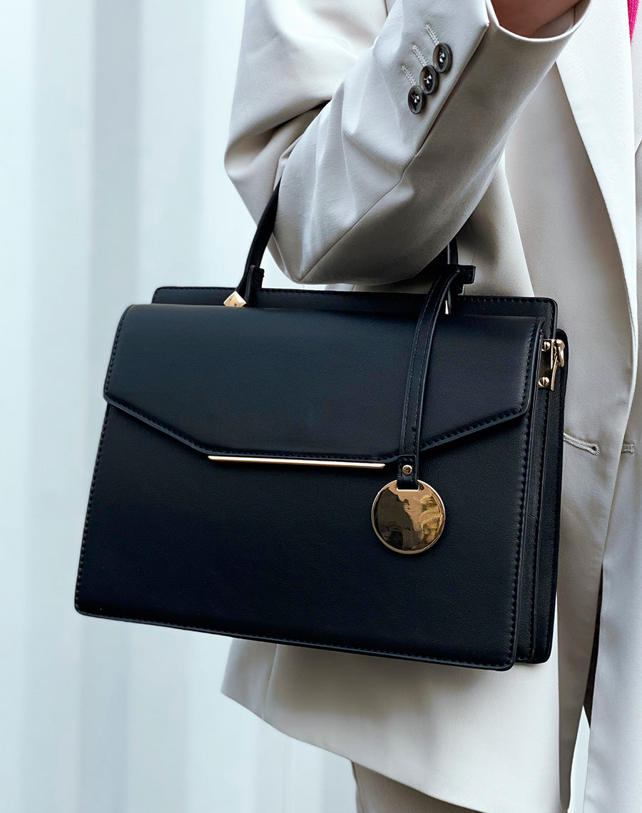 Sac à main noir à double ouverture et détails dorés